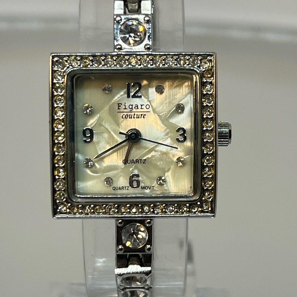 FIGARO COTOURE! This is a lovely watch very dressy! Mother of pearl size 6 3/4